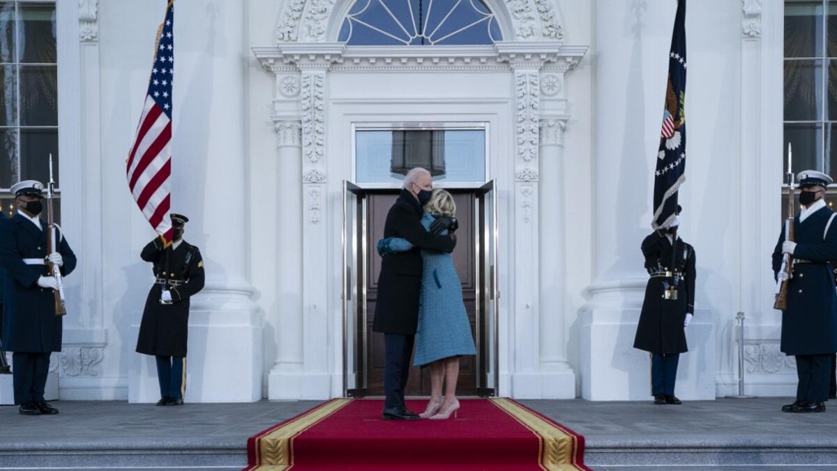 President Joe Biden and first lady Dr. Jill Biden hug as they arrive at the North Portico of the White House, on January 20, 2021, in Washington, DC. During today's inauguration ceremony Joe Biden became the 46th president of the United States. Alex Brandon-Pool/Getty Images/AFP