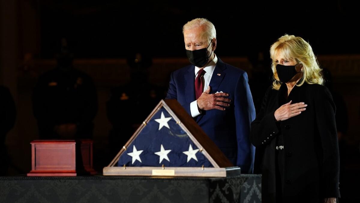 US President Joe Biden and First Lady Jill Biden pay their respects to late US Capitol Police officer Brian Sicknick, as he lies in honor in the Capitol Rotunda in Washington, DC February 2, 2021. Sicknick died on January 7 from injuries he sustained while protecting the US Capitol during the January 6 attack on the building erin schaff / POOL / AFP
