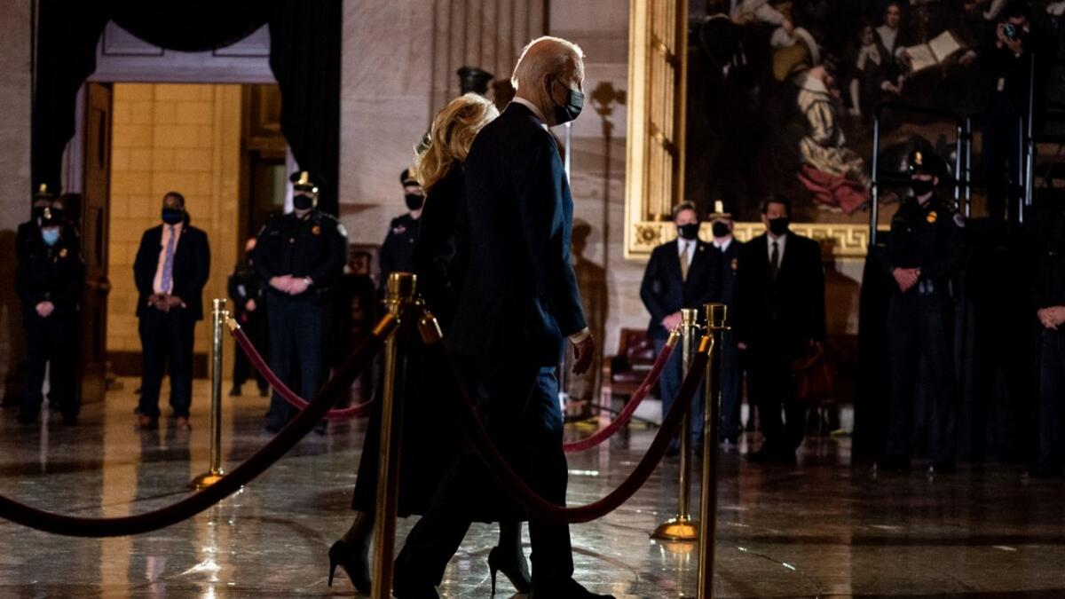 President Joe Biden and First Lady Jill Biden depart after paying their respects to the late Capitol Police Officer Brian Sicknick who lies in honor in the Rotunda of the Capitol in Washington, DC on February 2, 2021. AFP