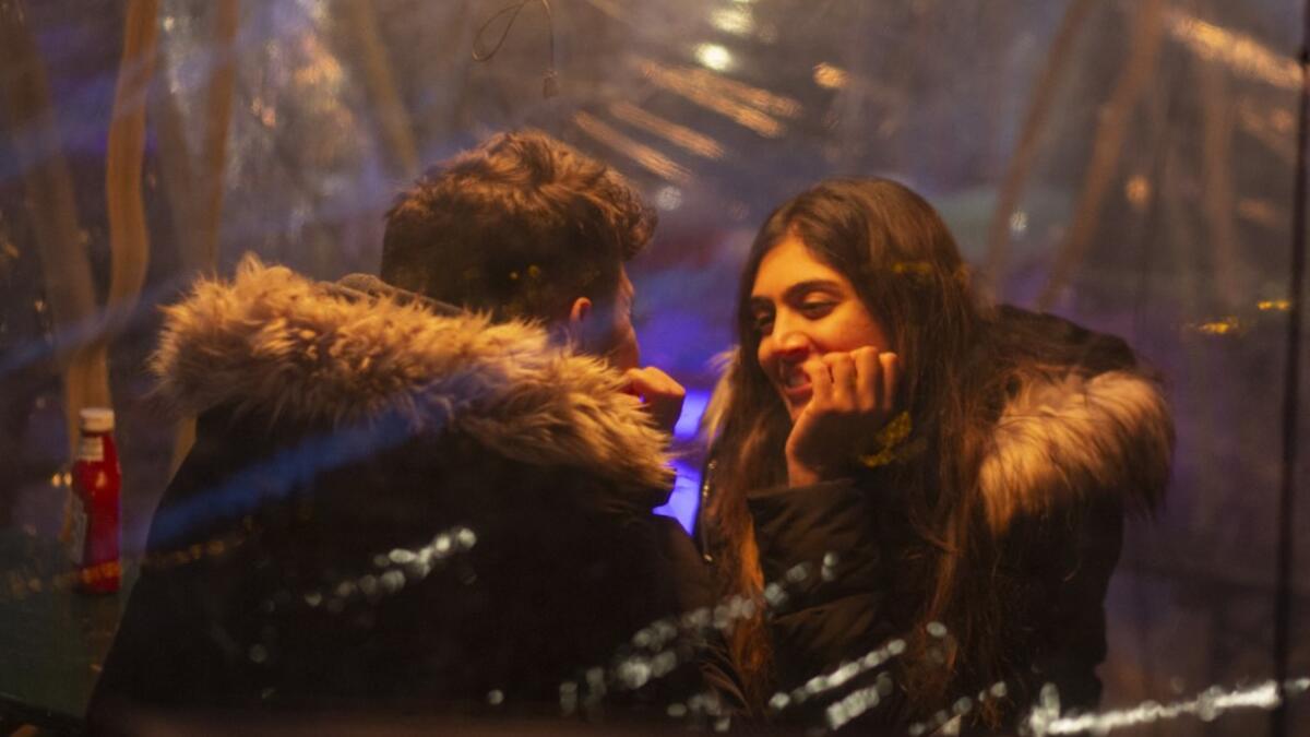 People celebrate Valentine's day at Magical pub The Cauldron in New York on February 13, 2021. New York Restaurants reopened on Friday Indoor dining at 25% capacity for Valentine's weekend. Kena Betancur / AFP