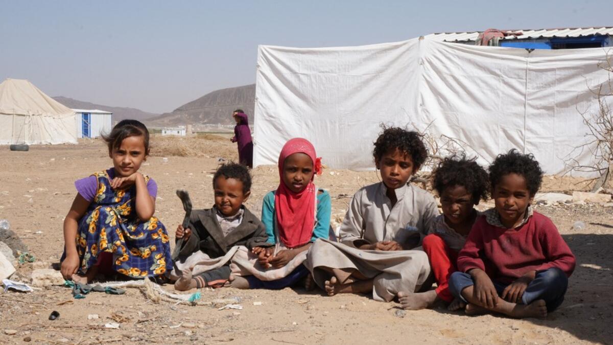 Yemeni children sit at the Jaw al-Naseem camp for internally displaced people on the outskirts of the northern city of Marib, on February 18, 2021 in the Saudi-backed Yemeni government's last northern bastion. Until early last year, life in Marib city was relatively peaceful despite the Yemen's civil war that erupted in 2014. The United Nations warned last week of a potential humanitarian disaster if the fight for Marib continues, saying it has put "millions of civilians at risk". More than 3.3 million have