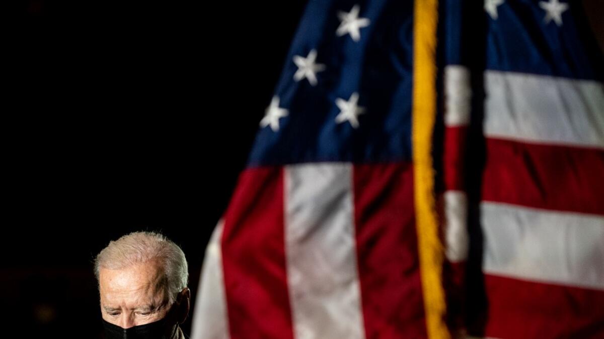 President Joe Biden pays his respects to U.S. Capitol officer Brian D. Sicknick as he lies in honor in the U.S. Capitol on February 2, 2021 in Washington, DC. Officer Sicknick died as a result of injuries he sustained during the January 6 attack on the U.S. Capitol. He will lie in honor until February 3 and then be buried at Arlington National Cemetery. Erin Schaff-Pool/Getty Images/AFP