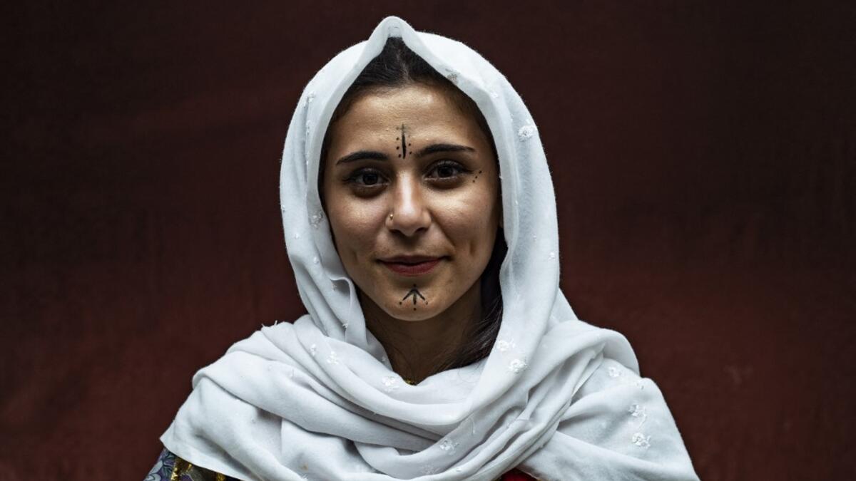 A Syrian Kurdish woman in traditional attire