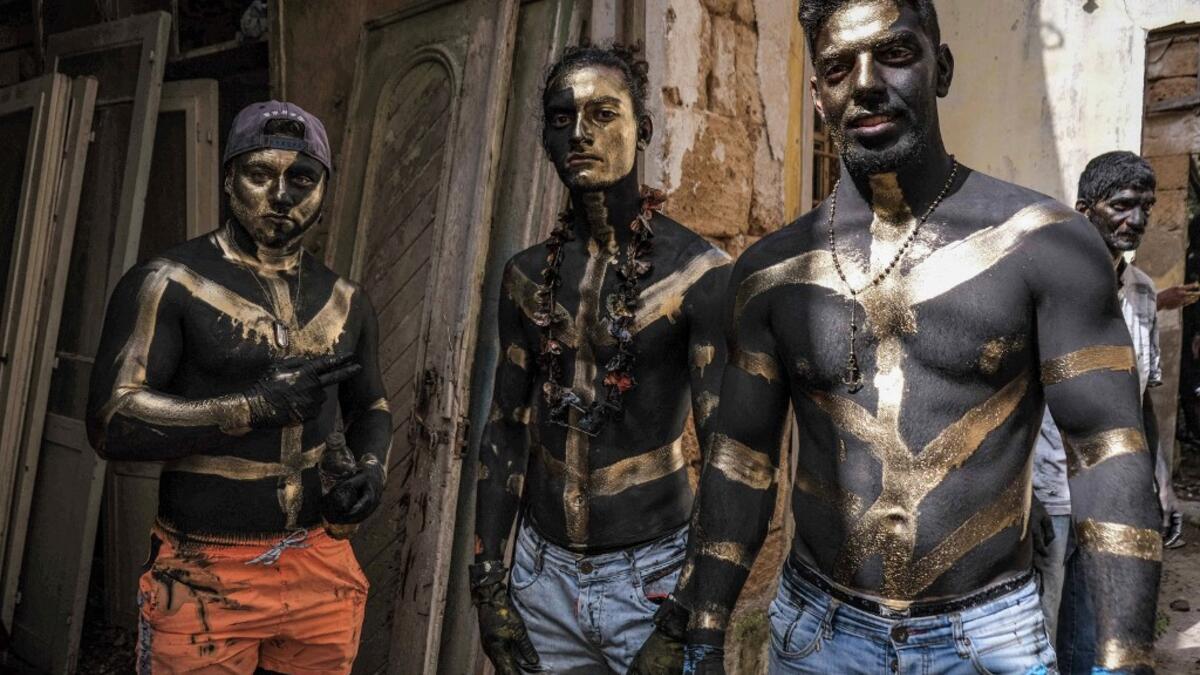 Carnival participants dressed in costume and wearing body paint