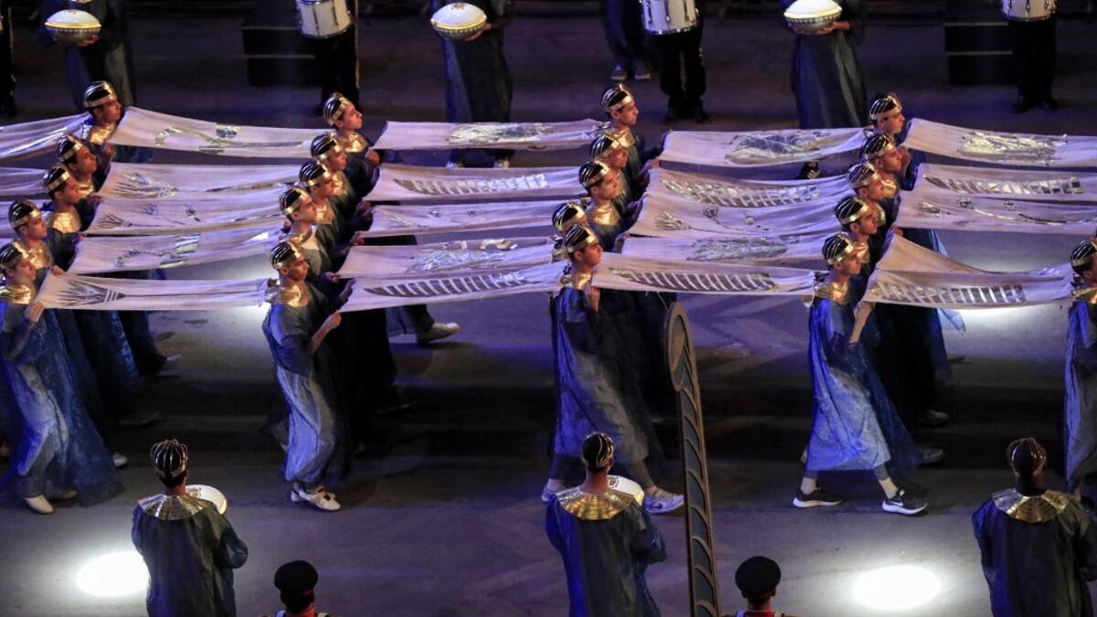 Performers dressed in ancient Egyptian costume march at the start of the parade of 22 ancient Egyptian royal mummies departing from the Egyptian Museum in Cairo's Tahrir Square