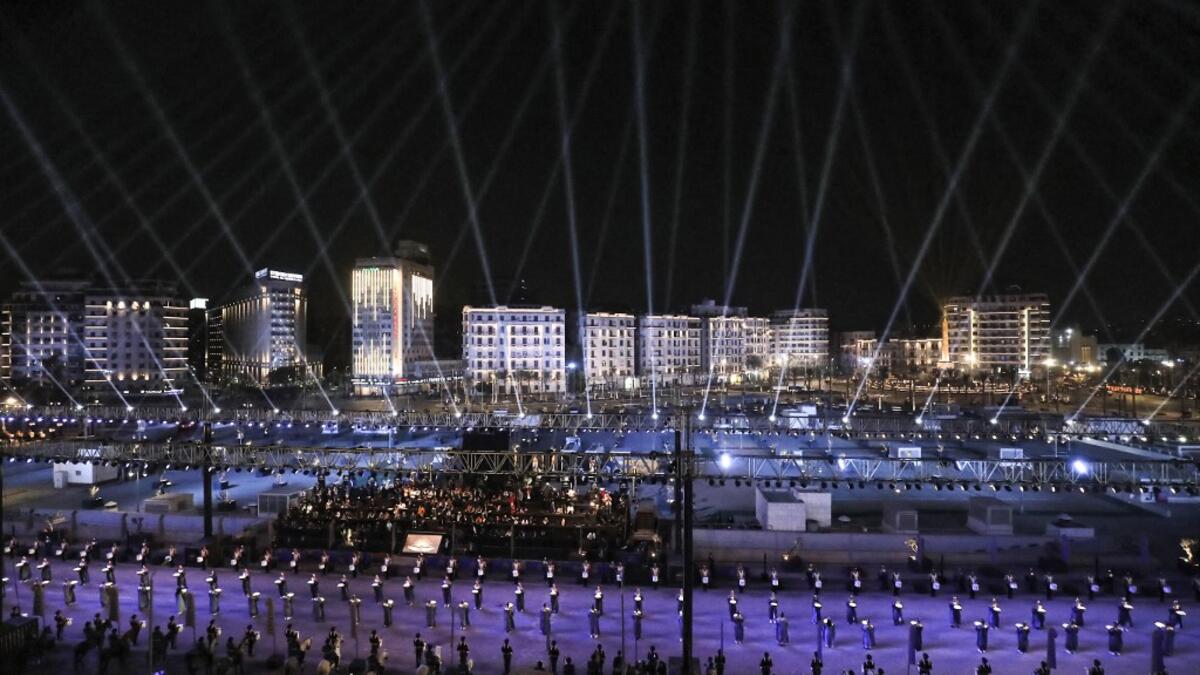 Performers dressed in ancient Egyptian costume wait at the start of the parade of 22 ancient Egyptian royal mummies