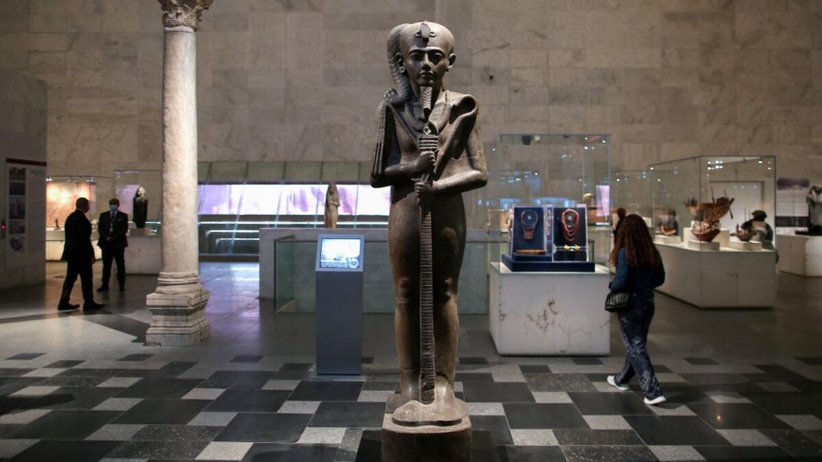 People visit an archaeological exhibit at Egypt's new National Museum of Egyptian Civilisation (NMEC)
