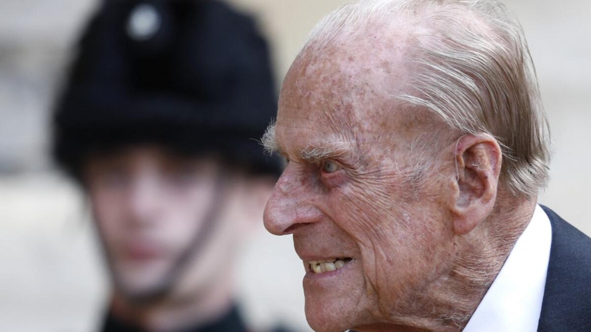 July 22, 2020 Britain's Prince Philip (C), Duke of Edinburgh passes a bugler during the transfer of the Colonel-in-Chief of The Rifles
