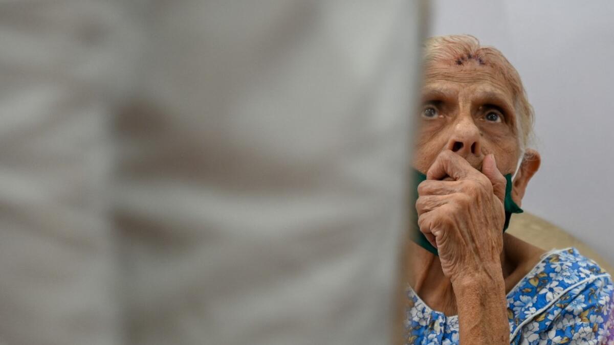 An elderly woman waits to receive a dose of the Covishield, AstraZeneca-Oxford's Covid-19 coronavirus vaccine