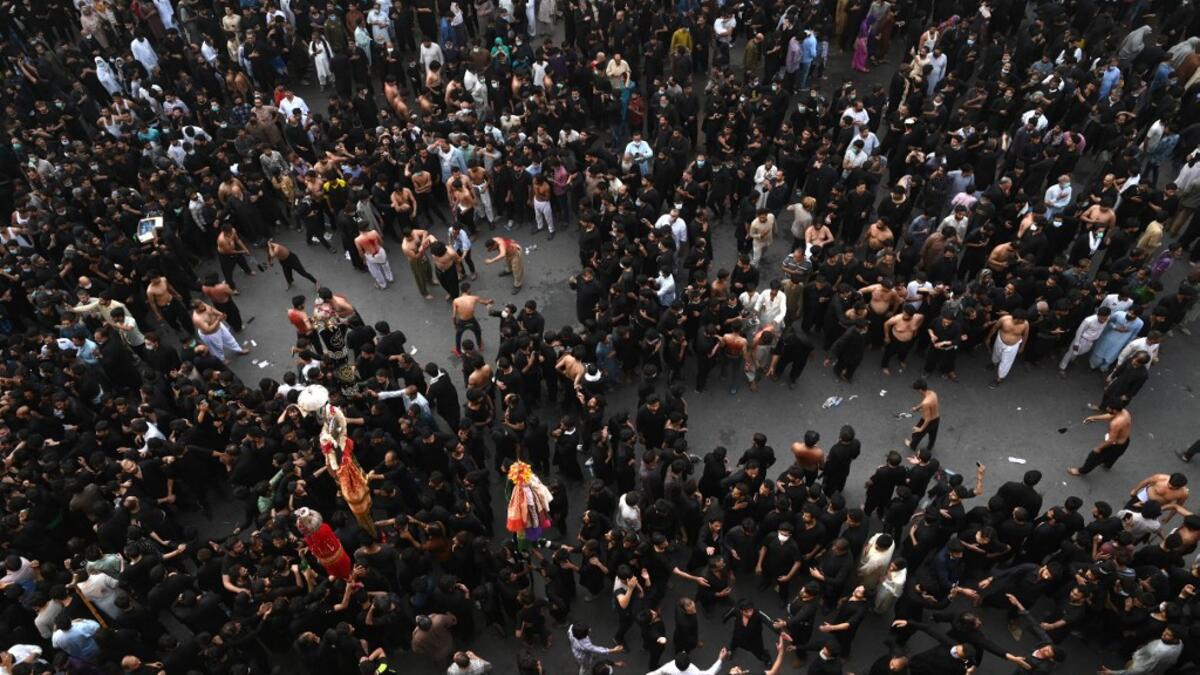Shiite Muslim devotees take part in a procession