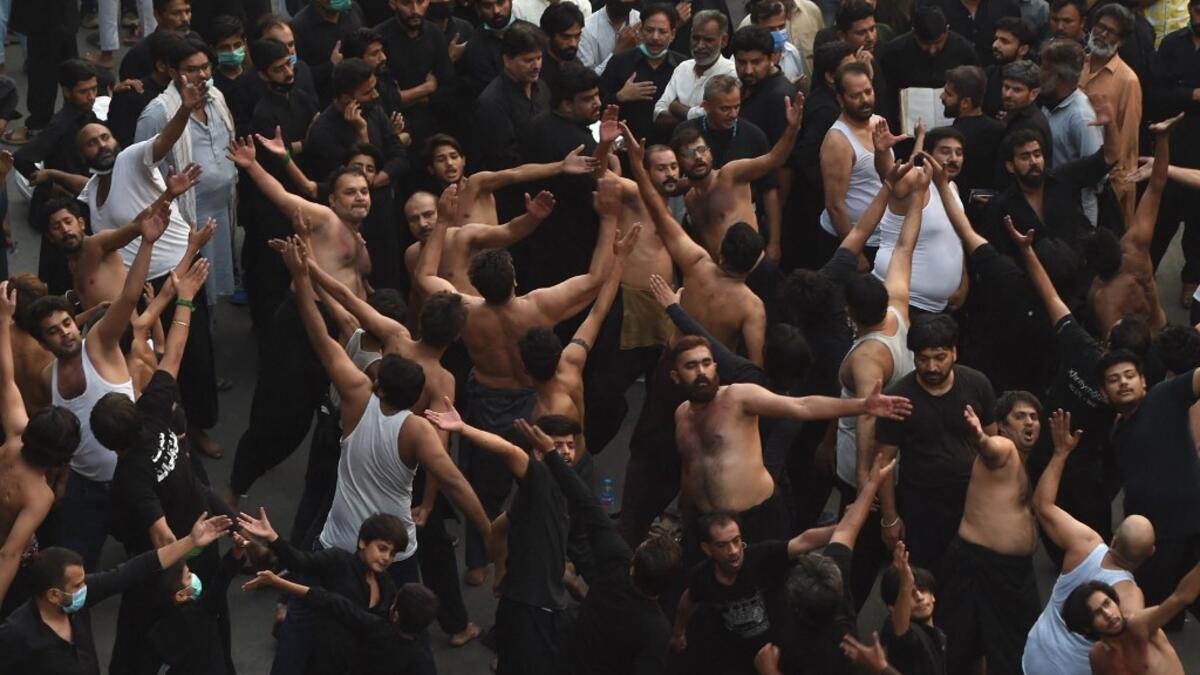 Shiite Muslim devotees take part in a procession to commemorate the death anniversary of Prophet Mohammad's companion and son-in-law Imam Ali in Lahore