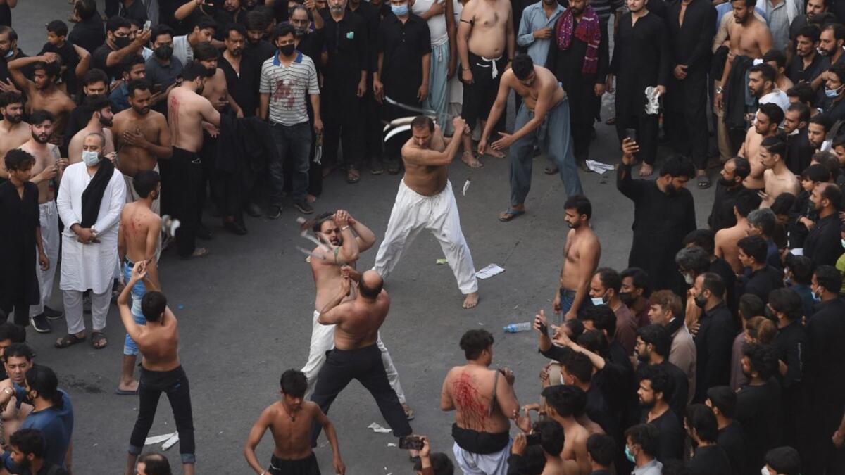 Shiite Muslim devotees take part in a procession to commemorate the death anniversary of Prophet Mohammad's companion and son-in-law Imam Ali in Lahore