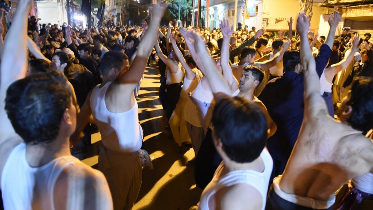Shiite Muslim devotees take part in a procession to commemorate the death anniversary of Prophet Mohammad's companion and son-in-law Imam Ali in Quetta