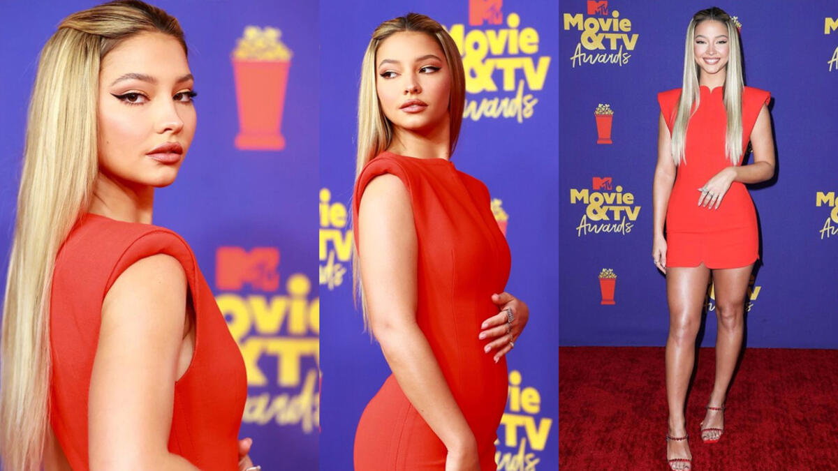 Madelyn Cline Hit the red carpet in a red Versace minidress with sculpted shoulders and Swarovski crystal encrusted sandals