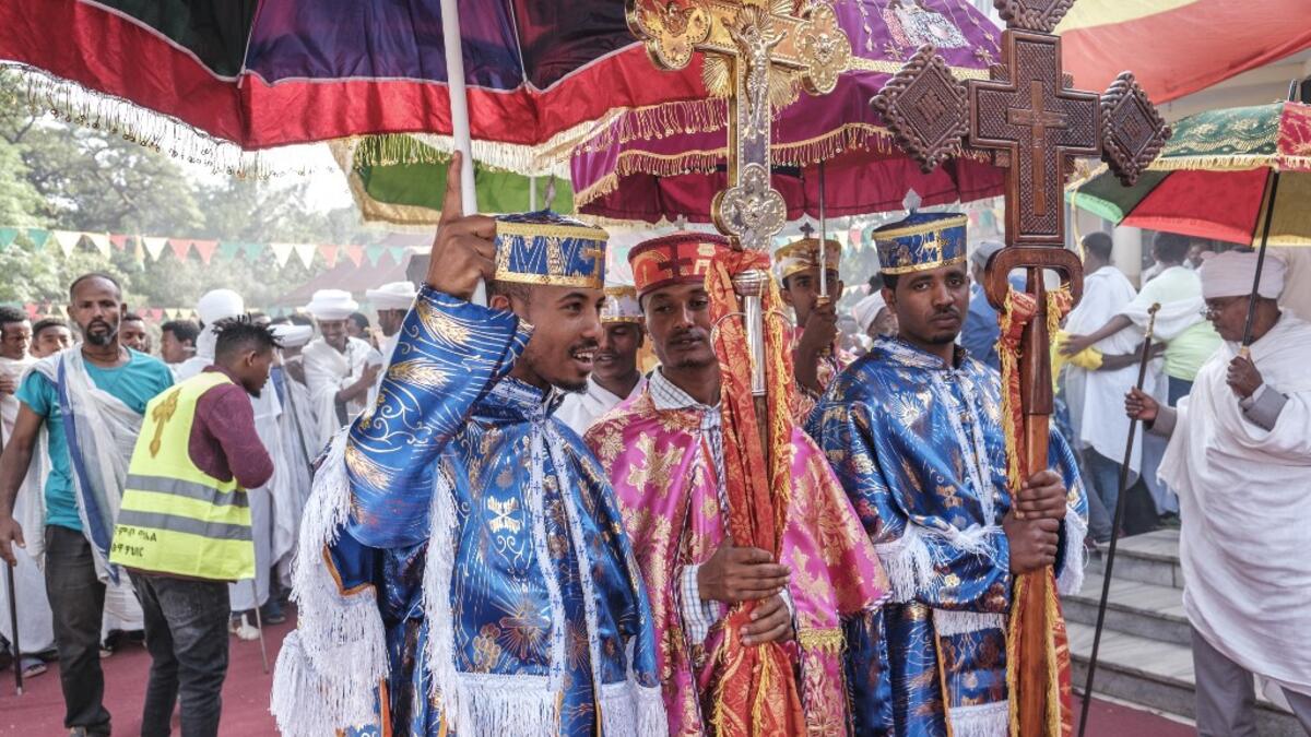 Ethiopian Orthodox deacons hold crosses as they parade during the religious celebration of Saint Michael in the city of Bahir Dar, Ethiopia