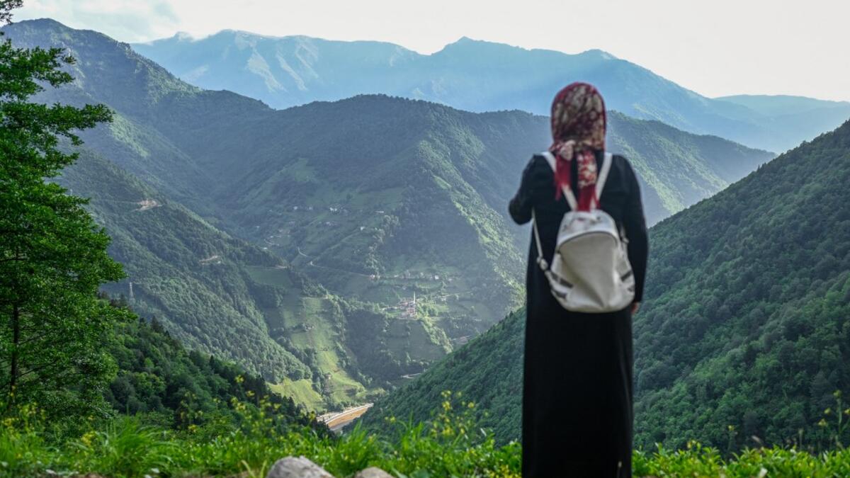 A villager stands at a high point to survey the damage to the hill sides by quarrying in Ikizdere in the Rize Province in the Black Sea region of Turkey on June 7, 2021. A government-friendly company plans to extract 20 million tons of stone from a quarry in the northeastern town of Ikizdere for one of President Recep Tayyip Erdogan's latest development projects. The locals are rising up in protest, challenging the government and its priorities in a region dear to the domineering Turkish leader's heart.