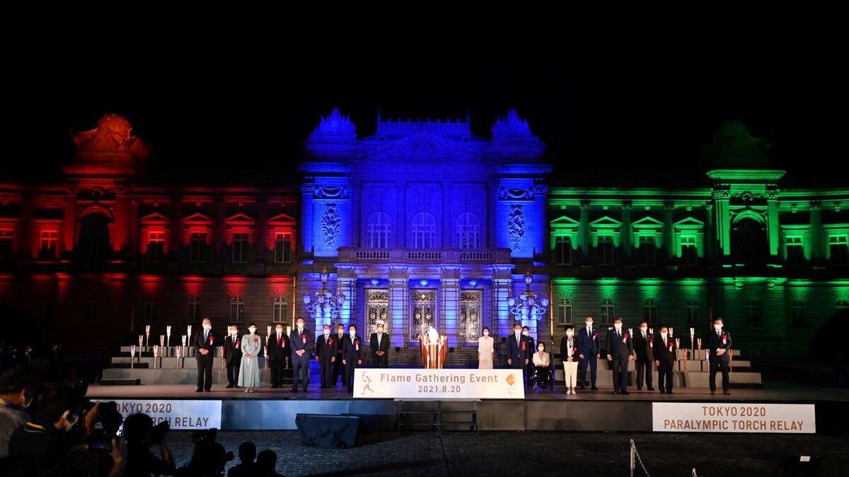 Participants pose for photographs following the Paralympic Flame Lighting Ceremony at the State Guest House Akasaka Palace in Tokyo on August 20, 2021.