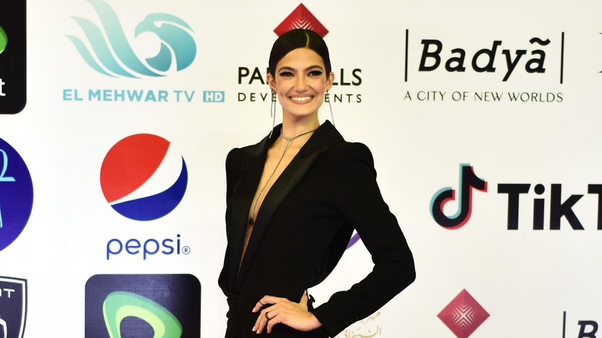 Egyptian actress Tara Emad poses on the red carpet during the opening of the 43rd edition of the Cairo International Film Festival (CIFF) at the Cairo Opera House in the Egyptian capital on November 26, 2021. (Photo by Sayed HASAN / AFP)