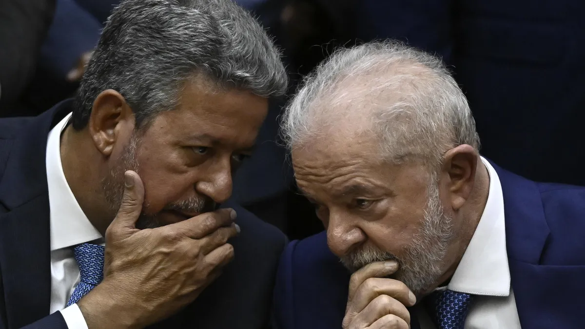 Brazil's new President Luiz Inacio Lula da Silva (R) talks with the President of the Chamber of Deputies Arthur Lira (L)