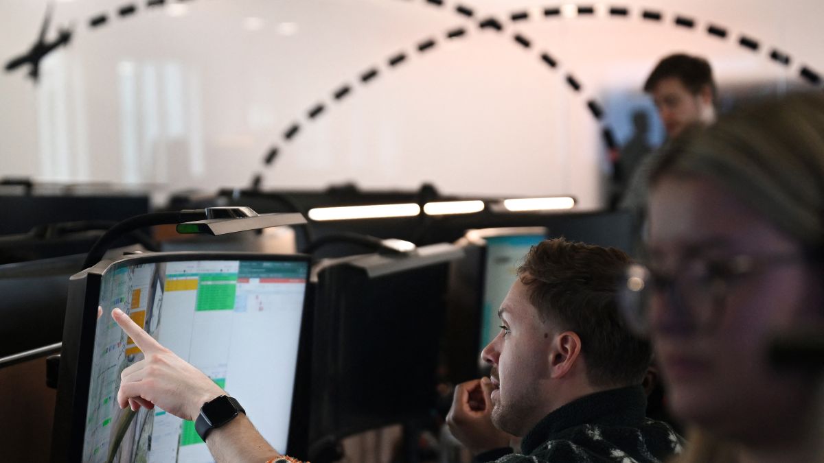 Members of staff work on computers in the Network Control Room inside Easyjet's new operations Integrated Control Centre (ICC) in Luton, north of London on May 22, 2024. A cutting-edge facility featuring artificial intelligence (AI) -- Easyjet's new control centre is tasked with handling about 2,000 mostly-European flights per day as the British airline eyes record summer demand. (Photo by Justin TALLIS / AFP)