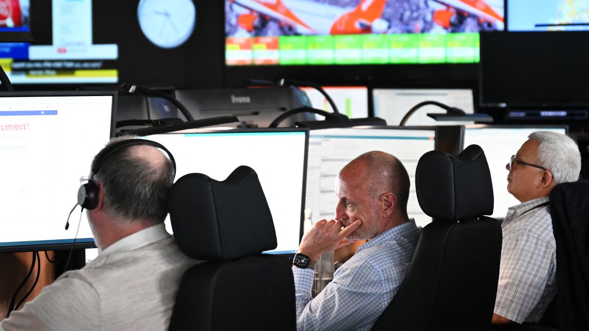 Members of staff work on computers in the Network Control Room inside Easyjet's new operations Integrated Control Centre (ICC) in Luton, north of London on May 22, 2024. A cutting-edge facility featuring artificial intelligence (AI) -- Easyjet's new control centre is tasked with handling about 2,000 mostly-European flights per day as the British airline eyes record summer demand. (Photo by Justin TALLIS / AFP)