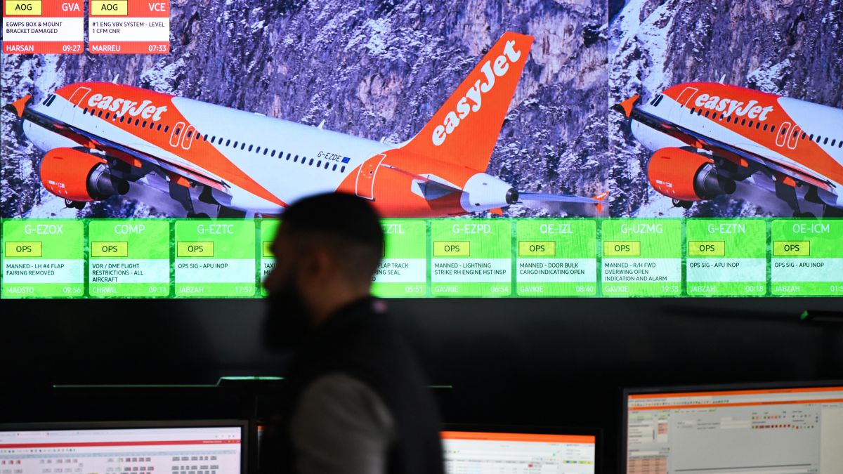 Members of staff work on computers in the Network Control Room inside Easyjet's new operations Integrated Control Centre (ICC) in Luton, north of London on May 22, 2024. A cutting-edge facility featuring artificial intelligence (AI) -- Easyjet's new control centre is tasked with handling about 2,000 mostly-European flights per day as the British airline eyes record summer demand. (Photo by Justin TALLIS / AFP)