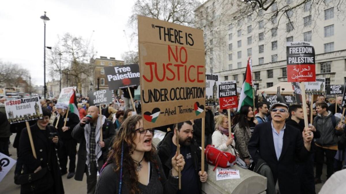 Protesters shout slogans and hold placards during a demonstration on Whitehall opposite Downing Street in central London on Apr. 7, 2018 in support of the Palestianians in the Gaza Strip calling for a stop to the killing organised by the Palestinian Forum in Britain. 

(Tolga AKMEN / AFP)