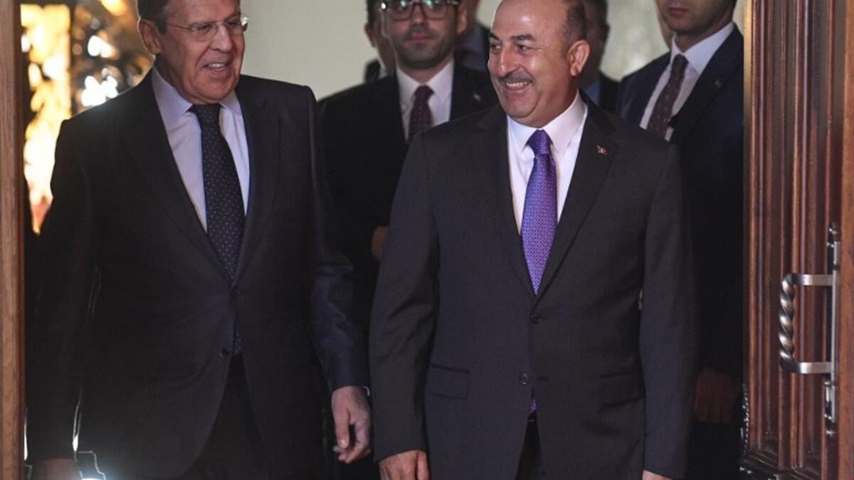 Russian Foreign Minister Sergei Lavrov (L) and his Turkish counterpart Mevlut Cavusoglu enter a hall during a meeting in Moscow on April 28, 2018. Alexander NEMENOV / AFP