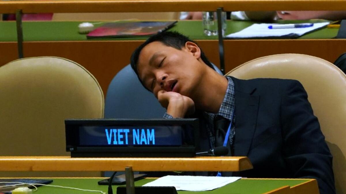 A member of Vietnamese delegation naps during the General Debate of the 73rd session of the General Assembly at the United Nations in New York September 25, 2018. 
Don EMMERT / AFP
