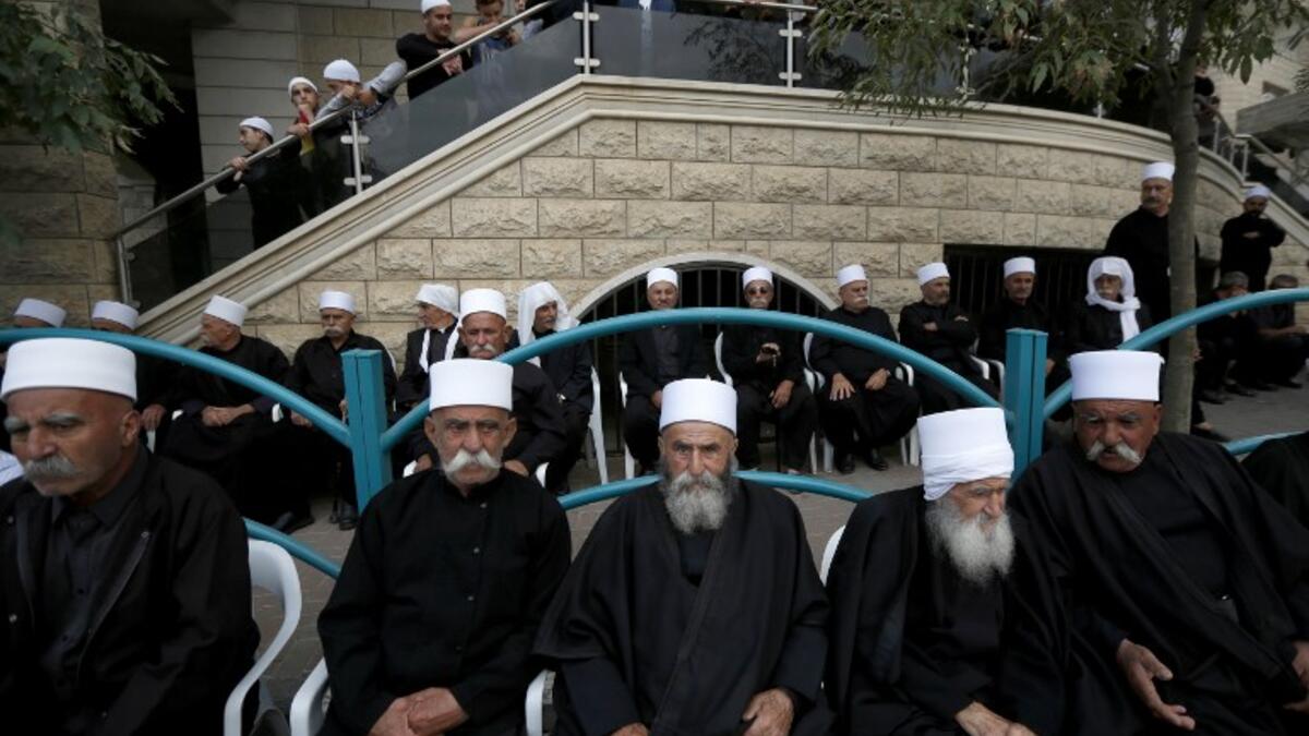 Druze men sit in the village of Majdal Shams in the Israeli-annexed Golan Heights. (JALAA MAREY / AFP)