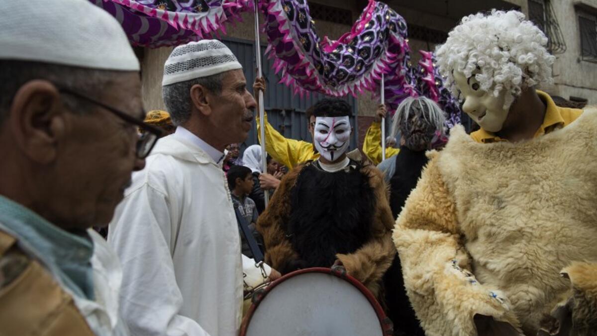 Young Moroccans take part in the Boujloud festival, a popular celebration also known as the 'Moroccan Halloween' in the Sidi Moussa district of Sale near Rabat, on October 27, 2018. 
FADEL SENNA / AFP