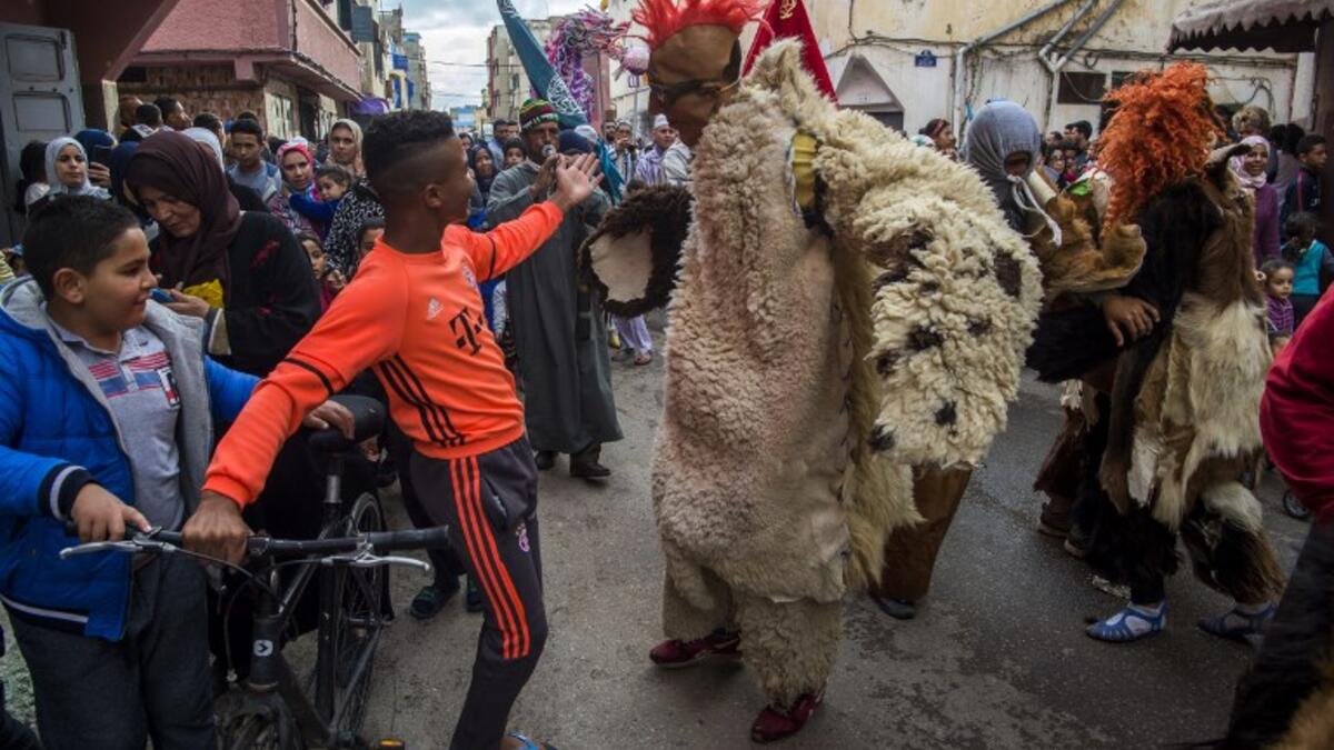 Young Moroccans take part in the Boujloud festival, a popular celebration also known as the 'Moroccan Halloween' in the Sidi Moussa district of Sale near Rabat, on October 27, 2018. 
FADEL SENNA / AFP
