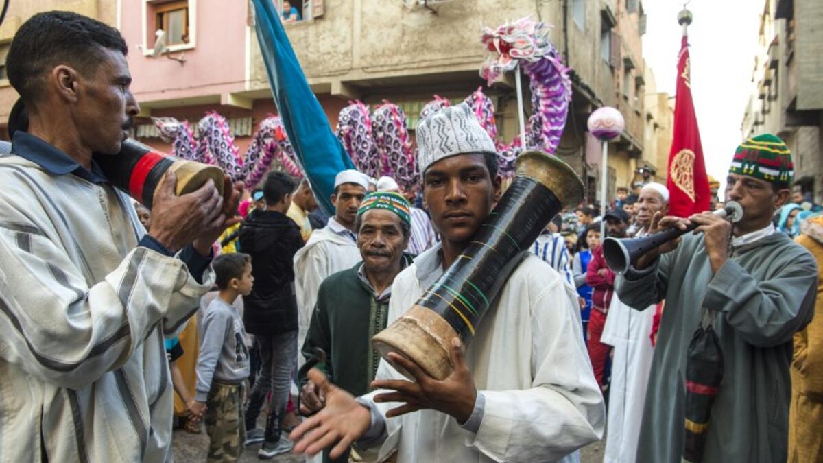 Young Moroccans take part in the Boujloud festival, a popular festival also known as the 'Moroccan Halloween' in the Sidi Moussa district of Sale near Rabat, on October 27, 2018. 
FADEL SENNA / AFP