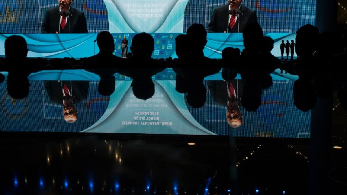 Turkish President Recep Tayyip Erdogan is displayed on a giant screen during the opening ceremony of Istanbul's new international airport, in the Arnavutkoy district, on the European side of Istanbul on October 29, 2018. 
BULENT KILIC / AFP