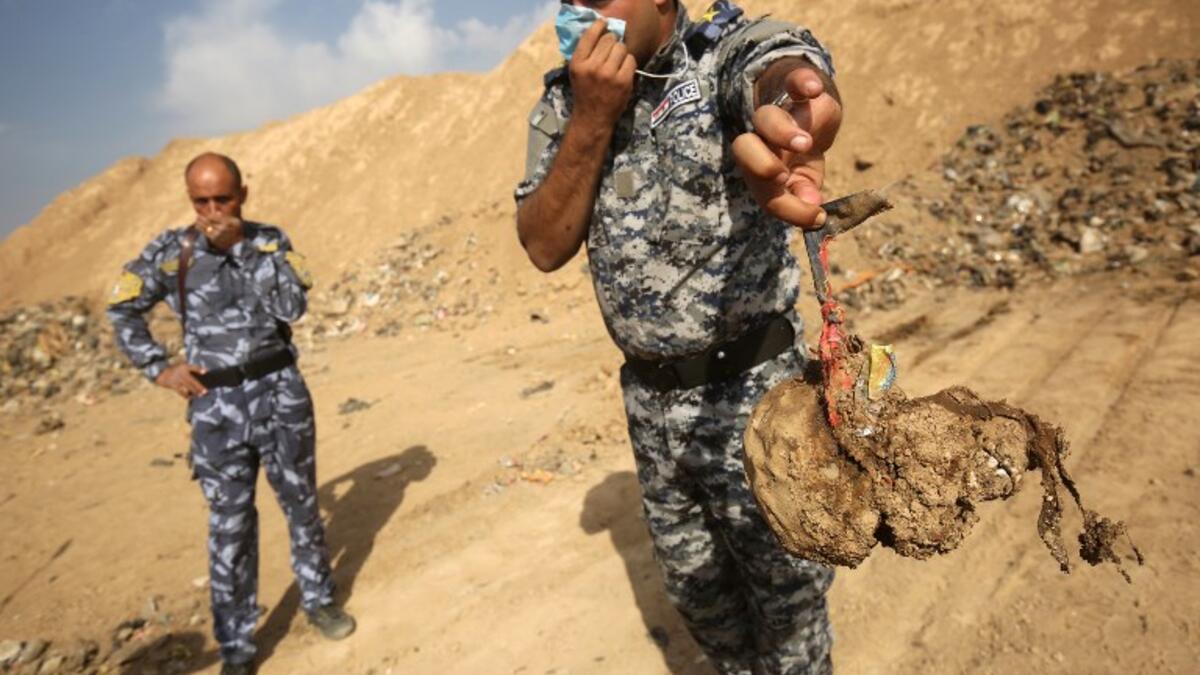 The United Nations in Iraq (UNAMI) and its human rights office said they had documented a total of 202 mass graves in parts of western and northern Iraq held by IS between 2014 and 2017. (AHMAD AL-RUBAYE / AFP)