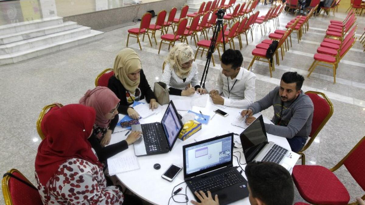 Iraqi youths work at "The Station", Baghdad's incubator for would-be entrepreneurs, in the Iraqi capital on November 17, 2018.
SABAH ARAR / AFP