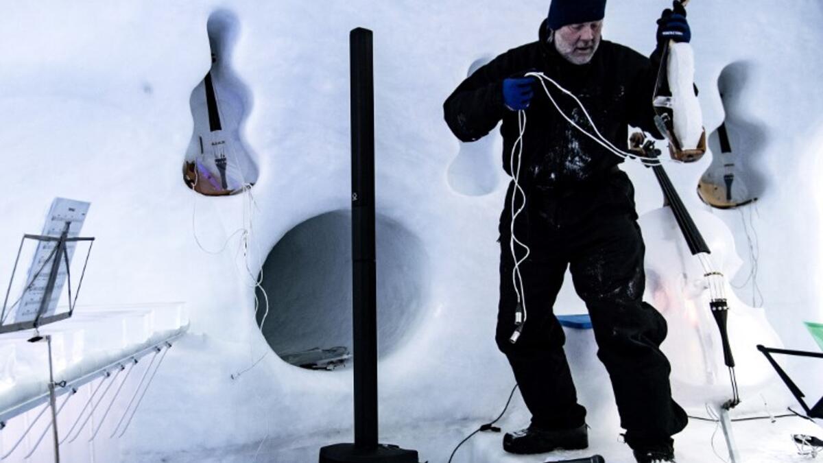 US artist Tim Linhart works on an ice violin in the "Ice Dome" on Presena Galcier, Tonale Pass, near Trento in northern Italy on January 18, 2018.
Marco BERTORELLO / AFP