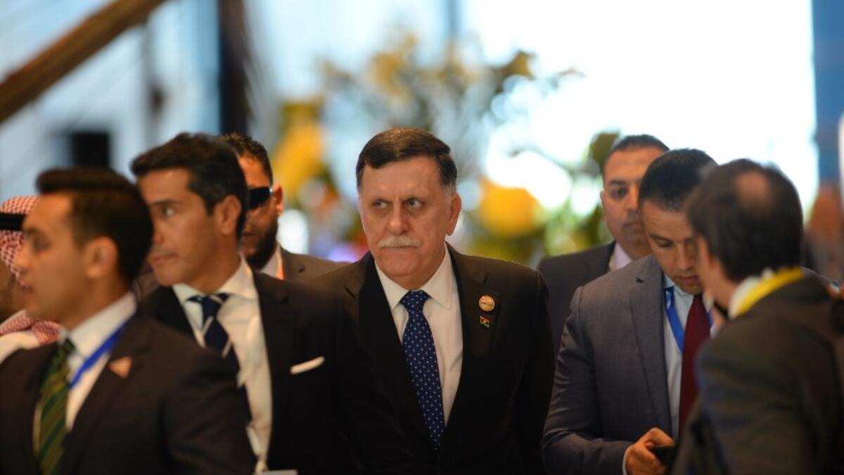 Libya's Prime Minister Fayez al-Sarraj arrives to the International Congress Centre on February 24, 2019, ahead of first joint European Union and Arab League summit in the Egyptian Red Sea resort of Sharm el-Sheikh. 
MOHAMED EL-SHAHED / AFP