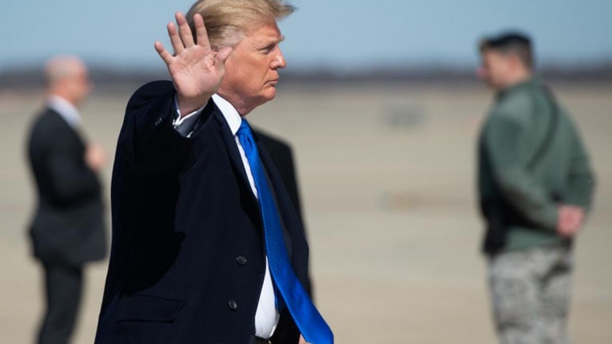 US President Donald Trump boards Air Force One prior to departure from Joint Base Andrews in Maryland, as he travels to Hanoi, Vietnam for a second summit with North Korean leader Kim Jong Un.
SAUL LOEB / AFP