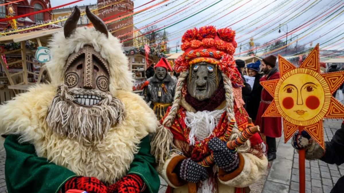Performers in scary masks entertain the public during the Shrovetide spring festival outside the Kremlin in Moscow on March 01, 2019. Mladen ANTONOV / AFP