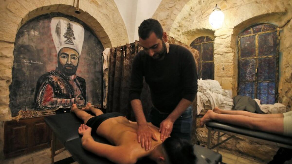 A man get a massage at the first traditional Turkish bath (Hammam) opening in the occupied Palestinian West Bank city of Hebron on March 11, 2019.
HAZEM BADER / AFP