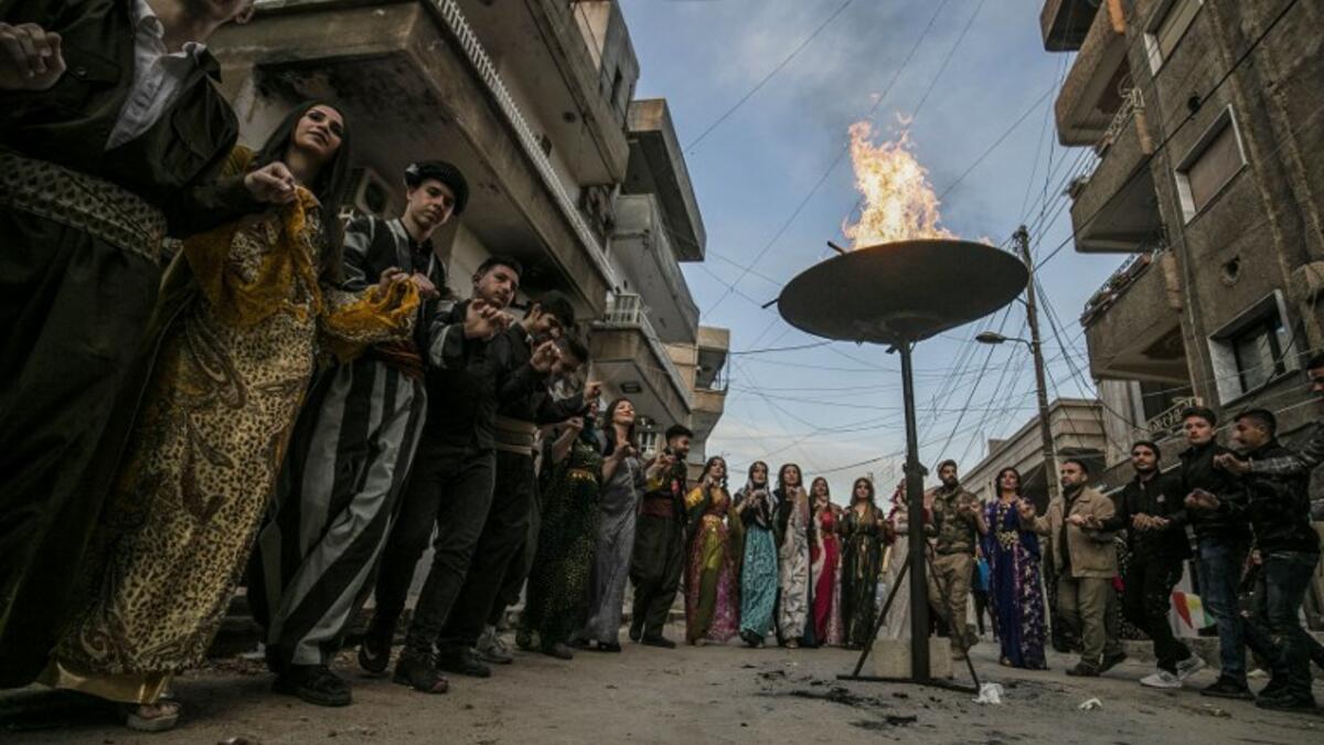 Kurds dressed in traditional outfits celebrate Nowruz (Noruz) in the Kurdish-controlled city of Qamishly in northeastern Syria on March 20, 2019.
Delil SOULEIMAN / AFP