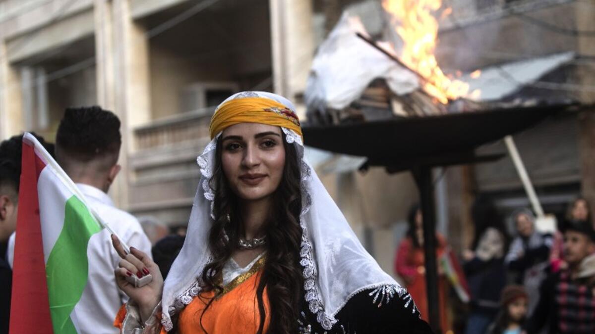 Kurds dressed in traditional outfits celebrate Nowruz (Noruz) in the Kurdish-controlled city of Qamishly in northeastern Syria on March 20, 2019.
Delil SOULEIMAN / AFP