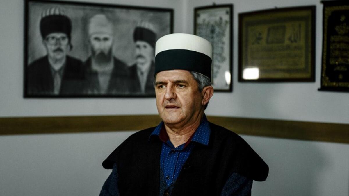 Albanian Dervish Agron Juniku speaks during an interview with AFP in Gjakova
Gent SHKULLAKU / AFP