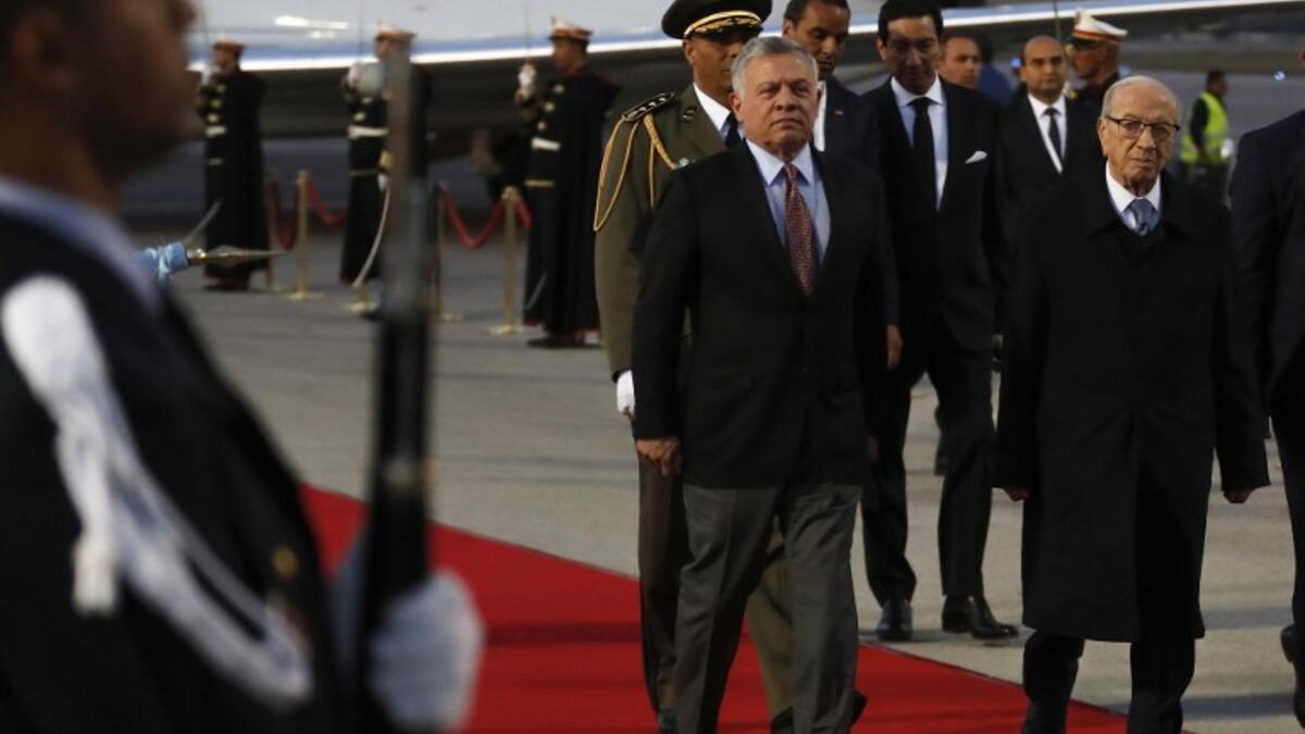 Tunisian President Beji Caid Essebsi (R) receives King Abdullah II of Jordan upon his arrival at Tunis-Carthage international airport on March 30, 2019, to attend the Arab Summit tomorrow. 
Hussein Malla / POOL / AFP