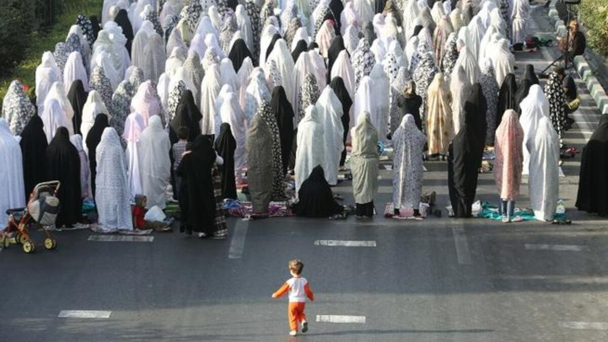 Iranian women pray on the first day of Eid al-Fitr for Shiite Muslims in Tehran on August 9, 2013. (AFP)