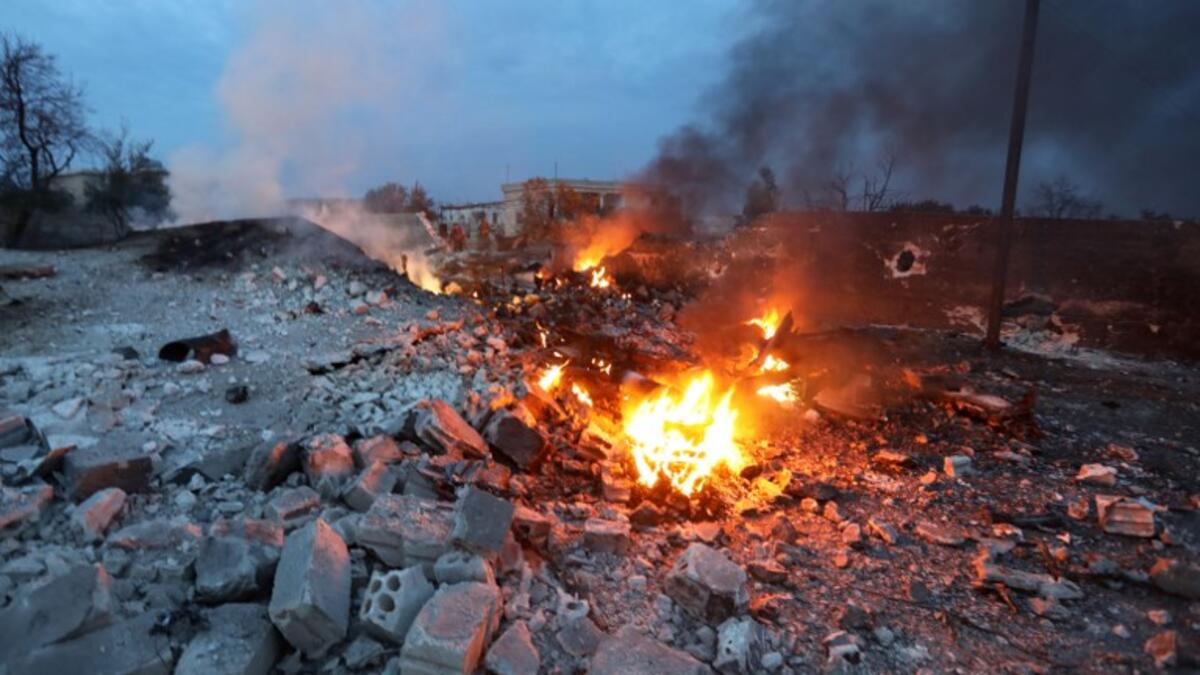 A picture taken on Feb. 3, 2018, shows smoke billowing from the site of a downed Sukhoi-25 fighter jet in Syria's northwest province of Idlib. Rebel fighters shot down a Russian plane over Syria's northwest Idlib province and captured its pilot, the Syrian Observatory for Human Rights said. 

(OMAR HAJ KADOUR / AFP)