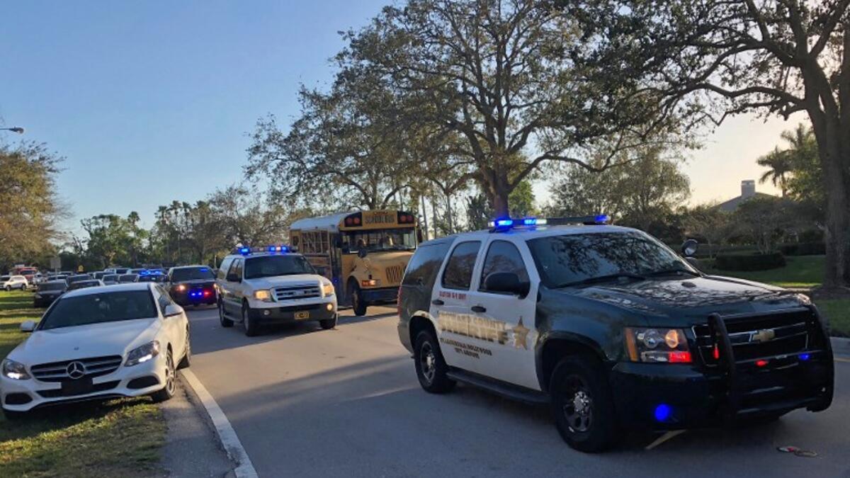 Sheriff vehicles are seen at Marjory Stoneman Douglas High School in Parkland, Florida on Feb.14, 2018 following a school shooting, an incident that officials said caused "numerous fatalities" and left terrified students huddled in their classrooms, texting friends and family for help.
(Michele Eve SANDBERG / AFP)