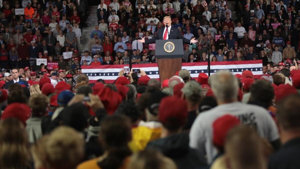 During a political rally in Mississippi on Tuesday night, Trump mockingly mimicked Ford, claiming her allegations against Kavanaugh lacked sufficient detail. (Scott Olson/Getty Images/AFP)