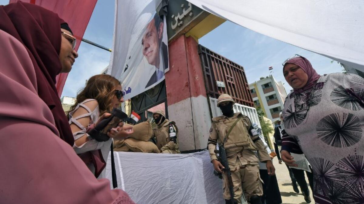 Balloting on elections day as one of the electorate casting vote (AFP/File Photo).